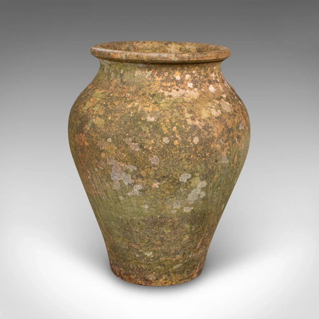 This is an antique garden vase. An English, terracotta outdoor planter for vines or bushes, dating to the late Victorian...