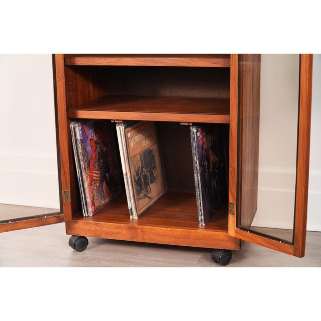 Handcrafted in beautifully grained solid walnut, this glass-front stereo component cabinet features two movable shelves...