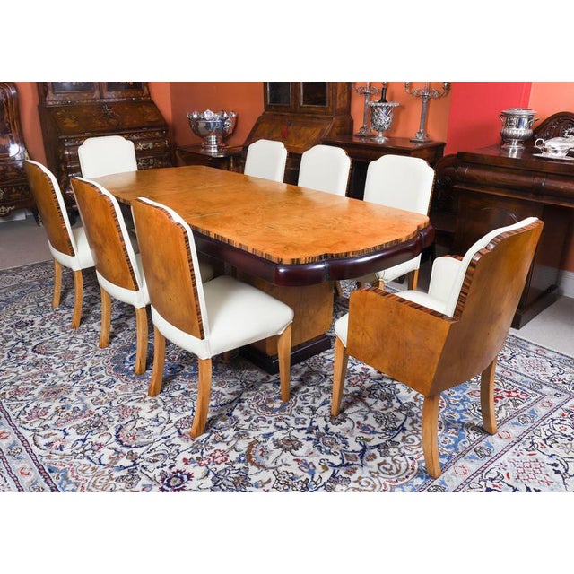A truly stunning antique Art Deco burr walnut and Coromandel dining table, attributed to the world renowned cabinet makers...