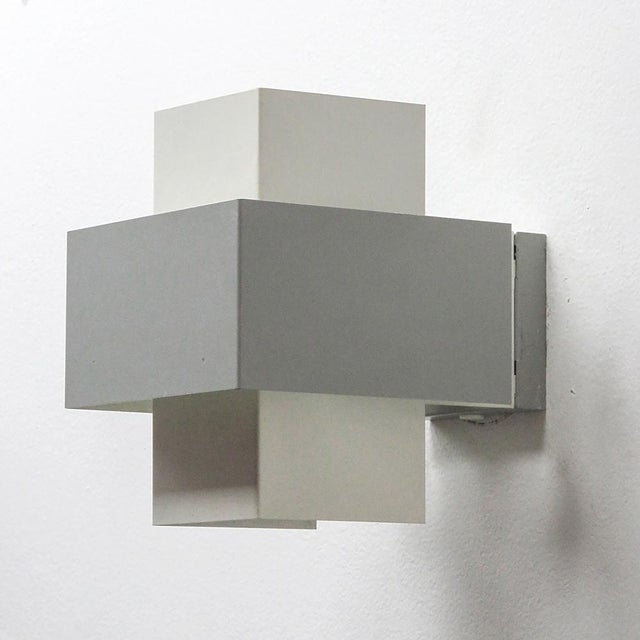 wonderful pair of geometric wall lights by Philips, Netherlands, 1960s, in light grey and white enameled metal, marked....