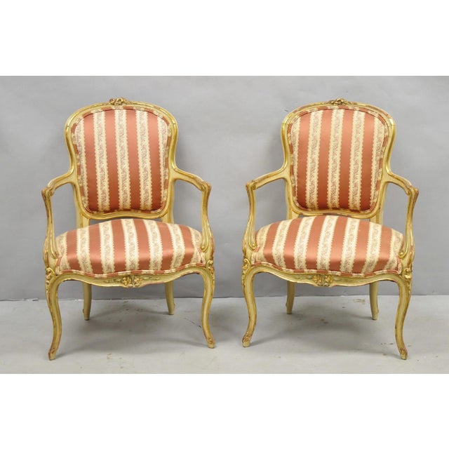 Antique French Louis XV Style Gold Giltwood Cream Painted Low Profile Fauteuil Arm Chairs with Pink Stripe Fabric - a...
