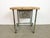 Vintage Industrial worktable from the 1960s. It features an iron construction, a solid wooden plate and an iron drawer....