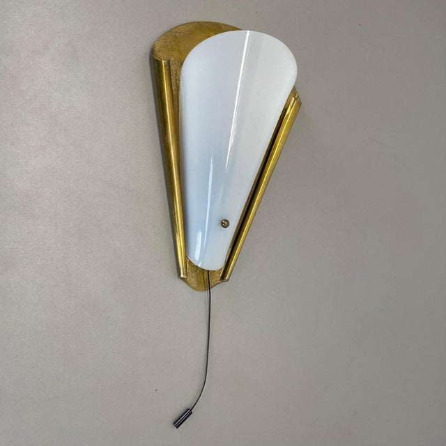 Article: brass and acrylic glass theatre wall light Origin: Italy Age: 1950s This modernist light was produced in Italy in...