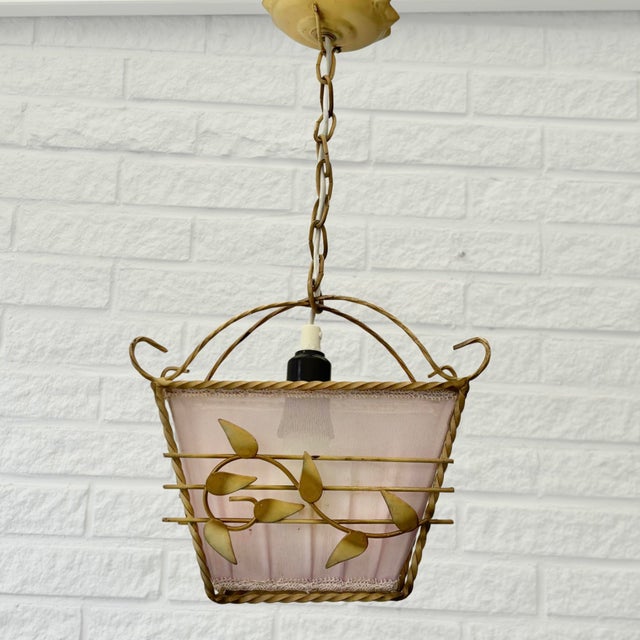 A Swedish pendant lamp produced by an unidentified manufacturer in the 1940s. This elegant fixture reflects the restrained...