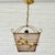 A Swedish pendant lamp produced by an unidentified manufacturer in the 1940s. This elegant fixture reflects the restrained...