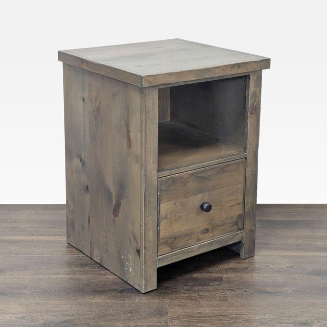 This Legends Furniture cabinet features a sturdy wooden build with a natural finish. It includes one spacious drawer for...