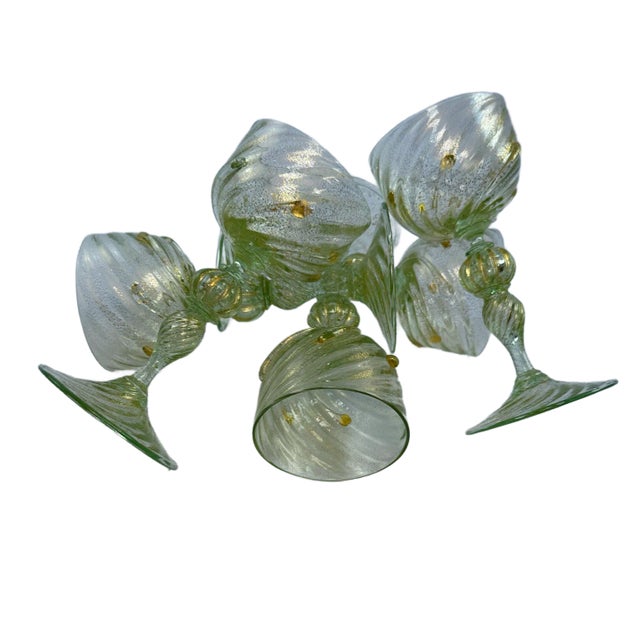 This is beautiful set of rare Salviati style Venetian Green and Gold Flecked wine glasses circa mid 20th century. These...