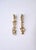 A pair of gold-tone abstract long drop earrings. Pair measure 3.13" long. For pierced ears. Dress up or down.