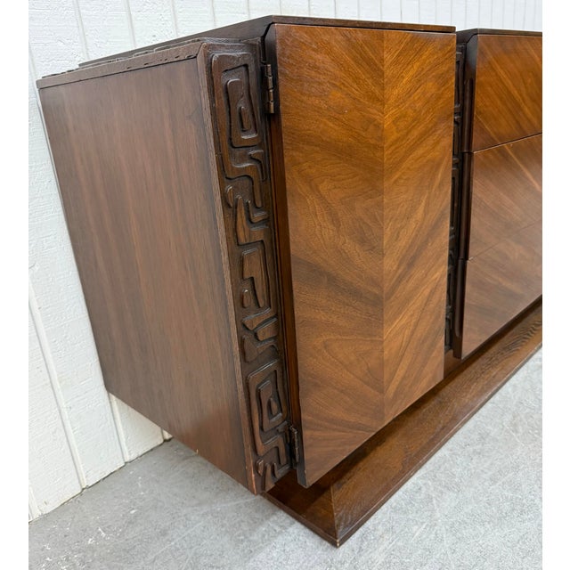 This listing is for a Mid-Century Modern United Tiki Walnut 9-Drawer Dresser. Featuring a straight line tiki style design,...