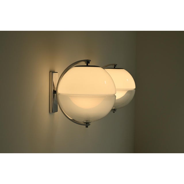 Set of 2 large globe wall lamps, 1960s Italy. Although the designer remains unknown, the style closely resembles the work...