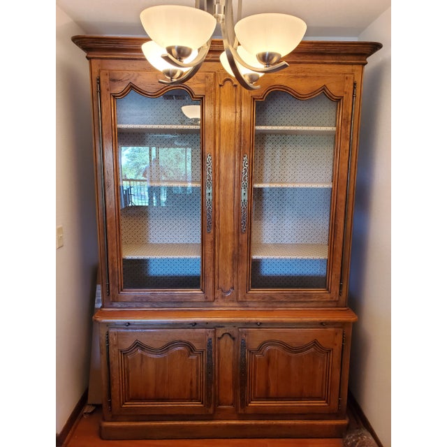 Dimensions in inches: 19d x 60w x 87h Baker Country French China Cabinet in excellent condition with movable shelves and...