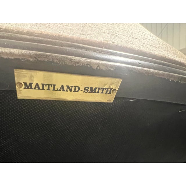 A beautiful Maitland-Smith Occasional Chair with dark wood frame with hand painted gilded accents finished in a stunning...