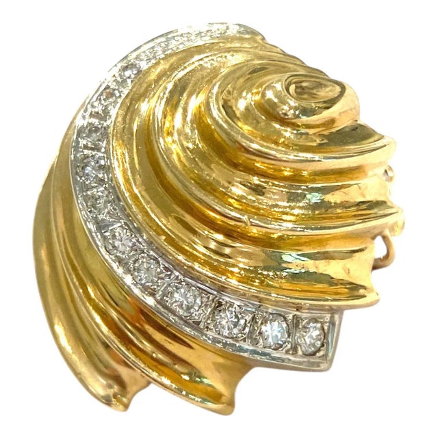Vintage 14K yellow gold earrings featuring a sea shell design accented with a swirl of brilliant-cut white diamonds. Post...