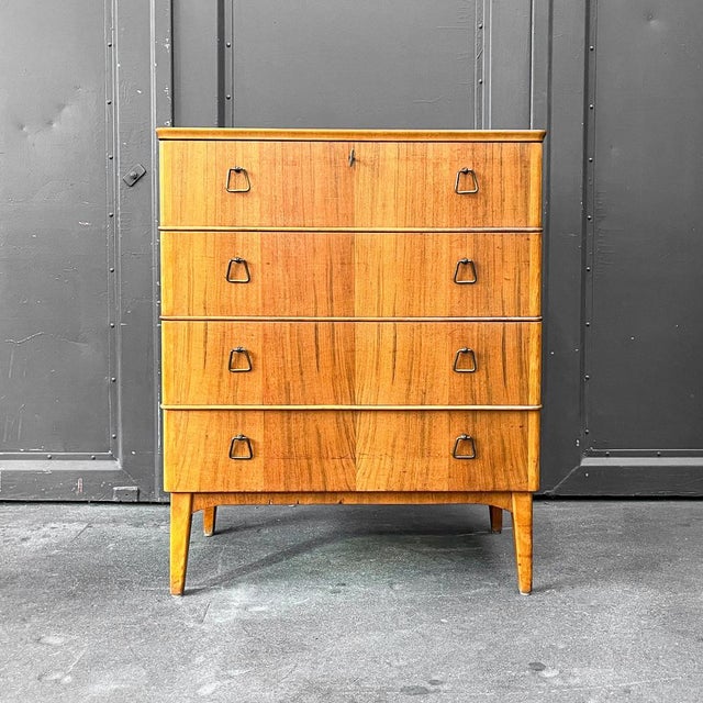 Chest of drawers style: mid-century · 1960s material: teak veneer features: four drawers condition: good condition with...