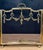 A striking and highly decorative Louis XVI–style brass fireplace screen dating to the mid to late 20th century, executed...