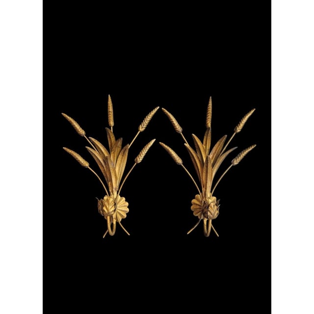 A beautiful pair of vintage tole sheaf of wheat wall candle holders. The holders are made of metal with cute little sheaf...