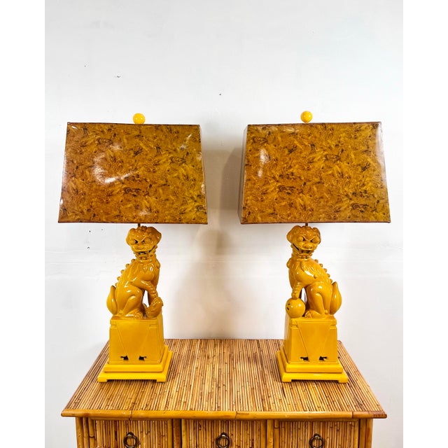 Vintage pair of ceramic foo dog lamps. A gorgeous yellow ochre/marigold/mustard yellow glaze with matching painted wood...