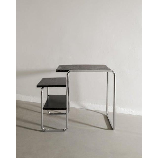 A very rare and early mid century bauhaus "b21" desk / side table with a patinated chromed tubular steel base and black...