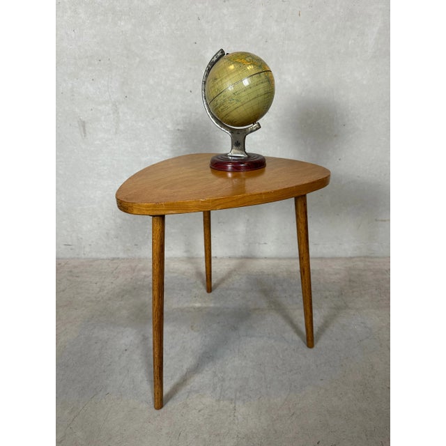 Original vintage tripod side table. Playful shape on slender legs. Handcrafted. Height: 41.5cm. Width: 38cm. Depth: 35cm....