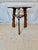 This 20th Century English Oak Tavern Cricket Table dates back to the early 1900's. The piece features a round plank top...
