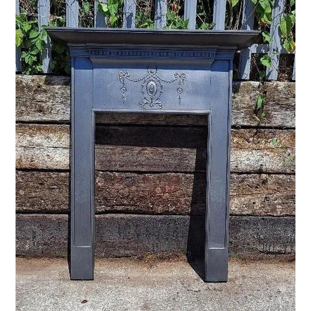 Edwardian cast iron fireplace surround with swags and bows, 1907 an elegant original edwardian cast iron fireplace...