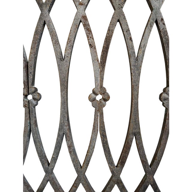 Architectural antique Indian teak and iron railing panel fragment which features a hand-forged lattice of elongated...