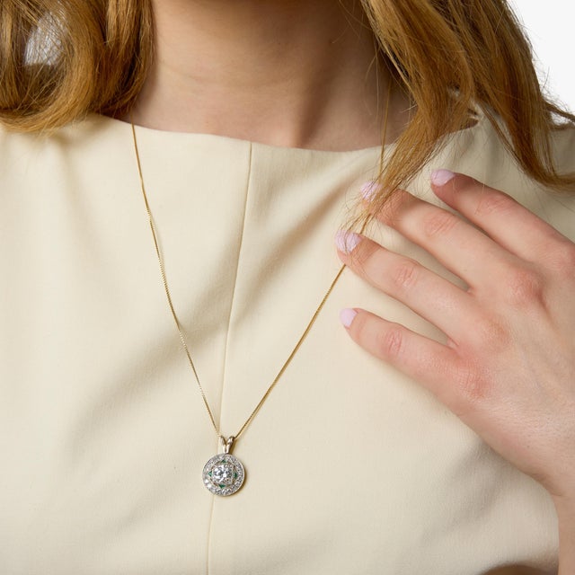 A refined and striking example of Art Deco design, this pendant necklace showcases the era’s signature balance of geometry...