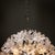 Large spherical Sputnik chandelier with metal body and flower-shaped Murano glass shades, giving the piece the playful...