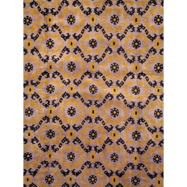 A Mid-Century Chinese Deco carpet. Measures: 9' 11" x 14' 11"