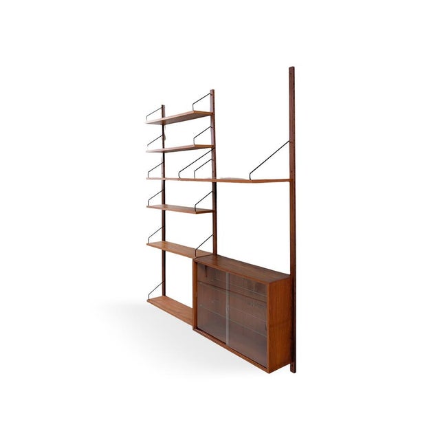 We are offering a beautiful, large wall shelf from the traditional Danish manufacturer Cado, dating from the 1960s, for...