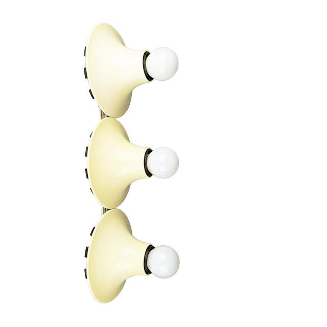 This lamp is composed by 3 single Teti lamps, joined together by an aluminum structure. It can be used as a ceiling lamp,...