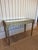 Elevate your interior with the refined elegance of this antique Italian Neoclassical giltwood console table, topped with a...