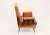 Mid-Century armchair in walnut and faux leather, Made in Italy, 1960s. The armrests of the armchair are made of curved...