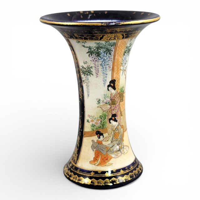 A refined antique Japanese Satsuma vase from the Meiji era, circa 1895, combining deep cobalt blue, generous gilding and...