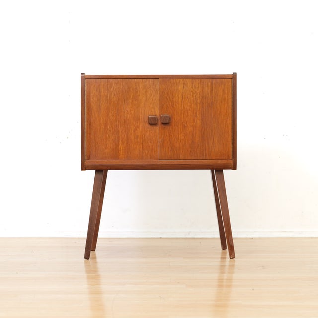 This mid-century vinyl record storage cabinet was made in the 1970s and is typical of the period. Produced in England this...