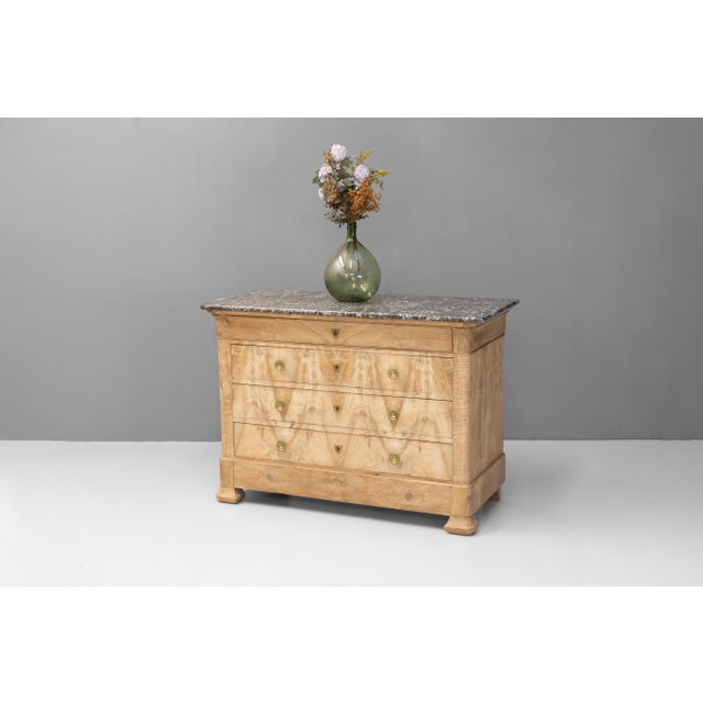 Late 19th Louis Philippe style four drawer stripped and bleached walnut commode with original brecciated marble top. New...