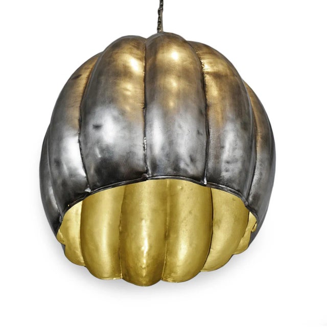 Nickel finish industrial metal hanging pendant light. Includes 34" hanging chain and matching ceiling plate.