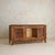 A French sideboard from the 1950s, designed with a concealed bar integrated within. Broad and grounded, the piece carries...