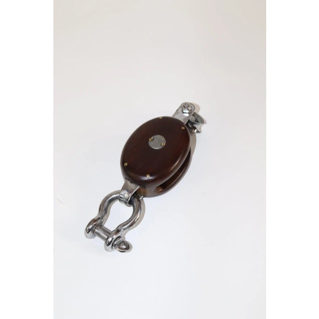 Polished and varnished single sheave yacht pulley. Weight is 2 pounds. X-137