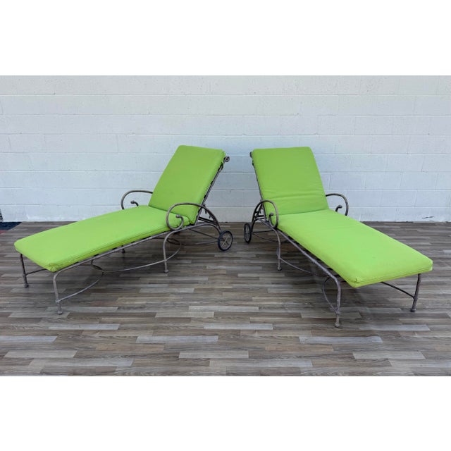 Beautiful vintage pair of Brown Jordan Florentine Collection chaise lounge chairs, featuring elegant scroll arms, woven...