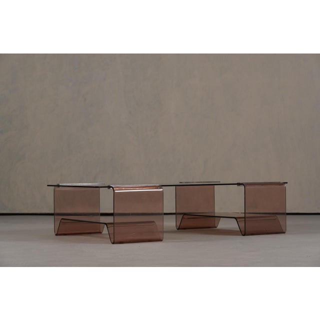 A vintage Michel Dumas acrylic glass and glass coffee table for Roche Bobois, France, 1970's. Designed by Michel Dumas,...