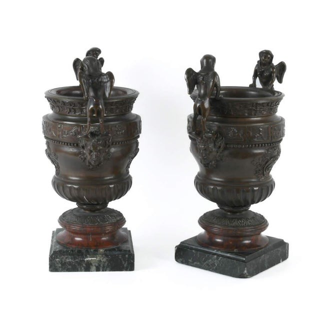 These Antique Pair of Urns with Sphinx Handled Bronzes on Marble Base blends classical design with artistic...