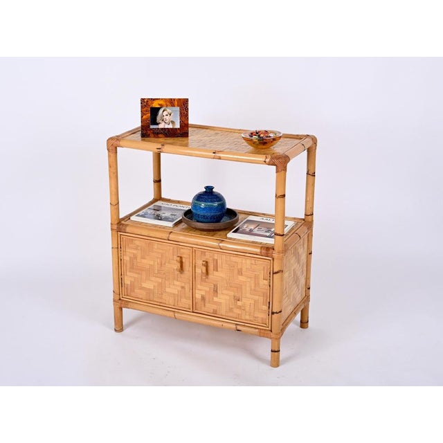 Beautiful storage cabinet in bamboo canes and woven rattan. This stunning organic cabinet was produced in Italy in the...