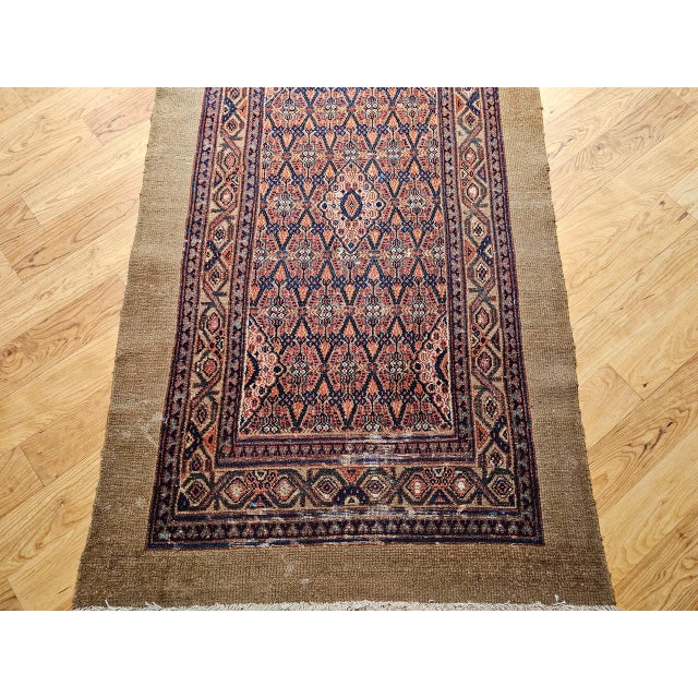 "This exceptional 19th century Persian Serab camelhair long runner exemplifies the timeless artistry and technical mastery...