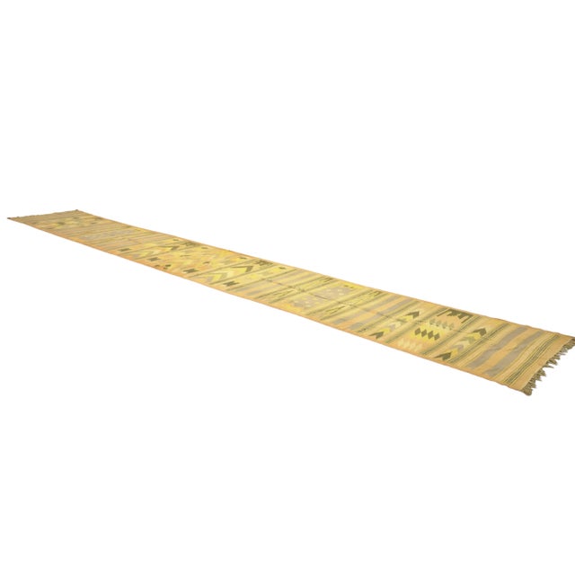 This vintage 4x25 Dhurrie flat weave runner is an exciting new entry in Rug & Kilim’s esteemed collection. Handwoven in...