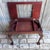A wonderful antique mahogany bijouterie (display) table in the Chippendale manner, featuring a hinged glass-topped lid...