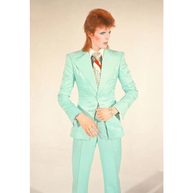 Bowie In Suit - signed limited edition print David Bowie in a mint green suit, 1973. (photo Mick Rock) paper size : 24x20...