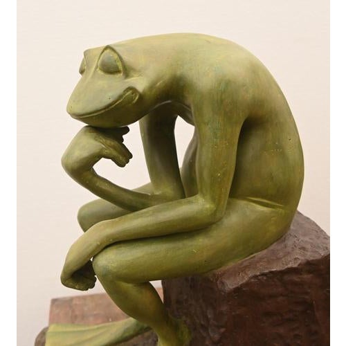 Unusual and whimsical sculptural figure depicting a frog - or toad - seated in a contemplative pose after Rodins famous...