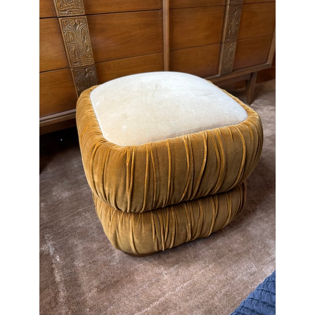 Textural ruching wraps around a segmented silhouette that's fully upholstered in two-tone velvet. Perched on an oak base,...