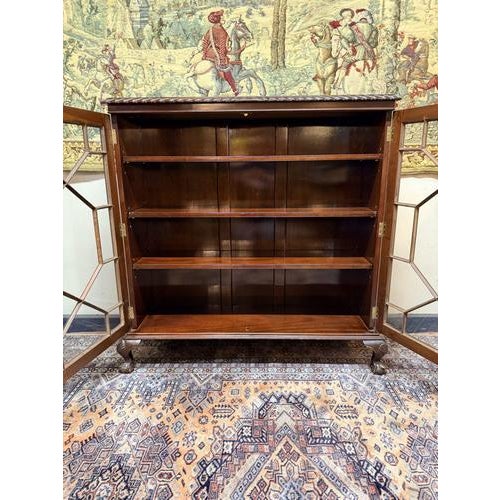 Elegant Edwardian style glazed display cabinet or bookcase in mahogany veneer, combining classic proportions with refined...